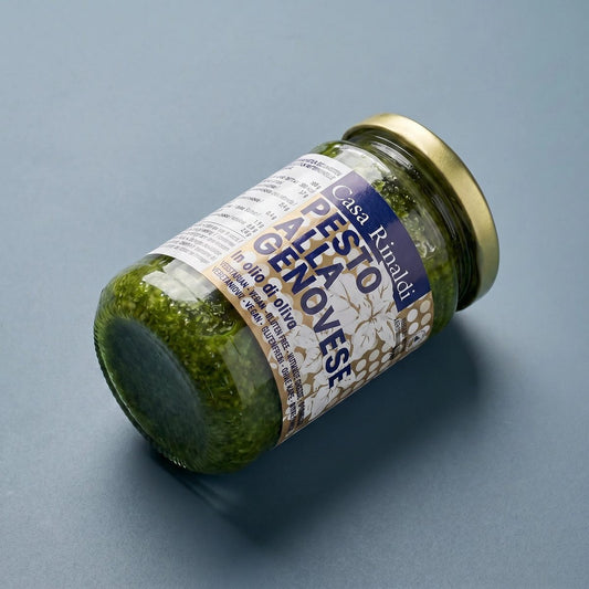Jar of Pesto Alla Genovese with a label on a gray background